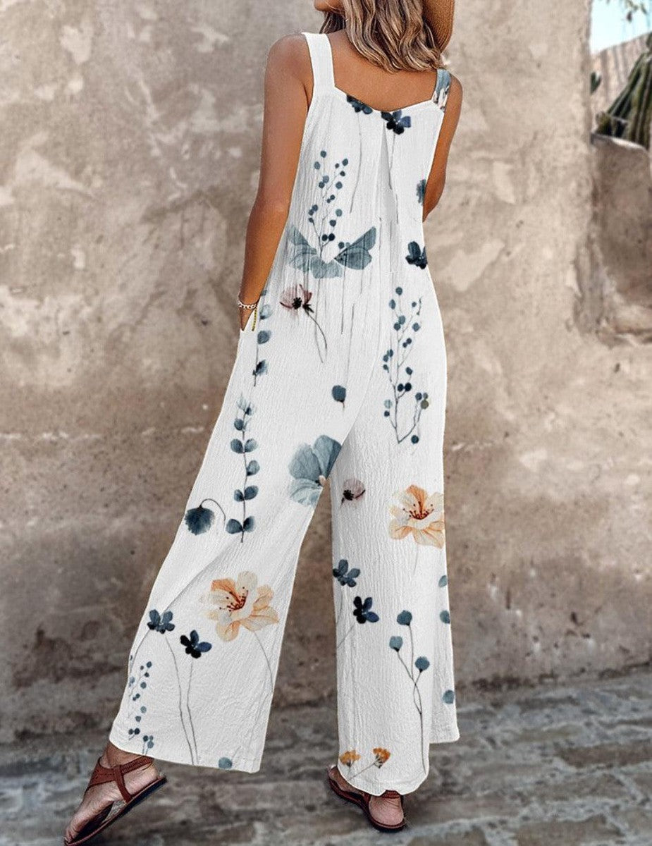 Mono blanco sin mangas con estampado floral azul y flores en tonos naranjas