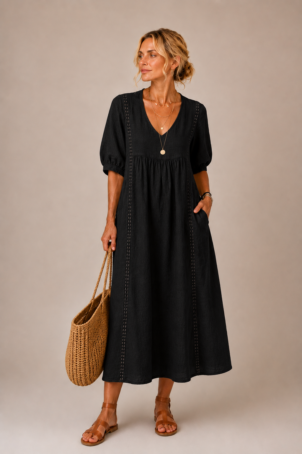 Vestido midi negro de verano con escote en V y mangas abullonadas, bordado vertical.