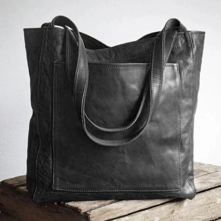 Bolso clásico Kimberly™ de cuero negro con asas dobles y bolsillo frontal
